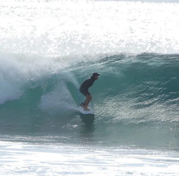 Tiago surfing in Indonesia, surf coach at Breakthrough Surf School