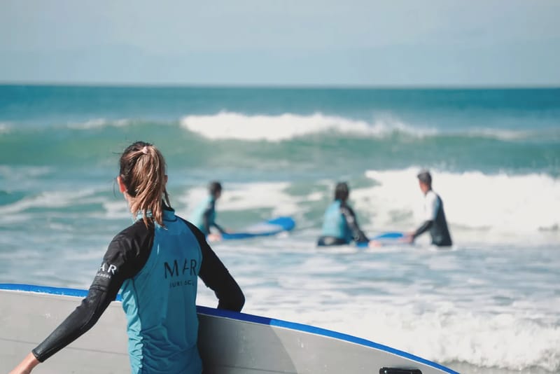 Instructor with students in the water